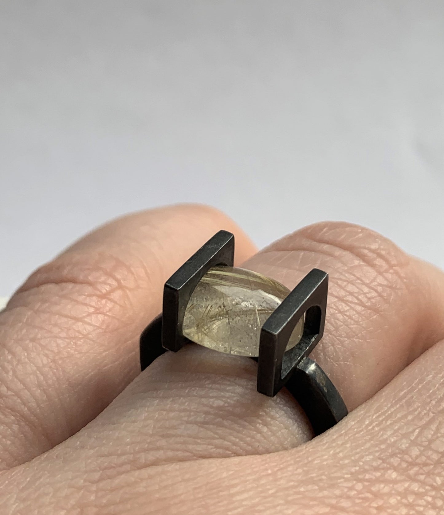 Oval golden rutilated quartz moving stone ring