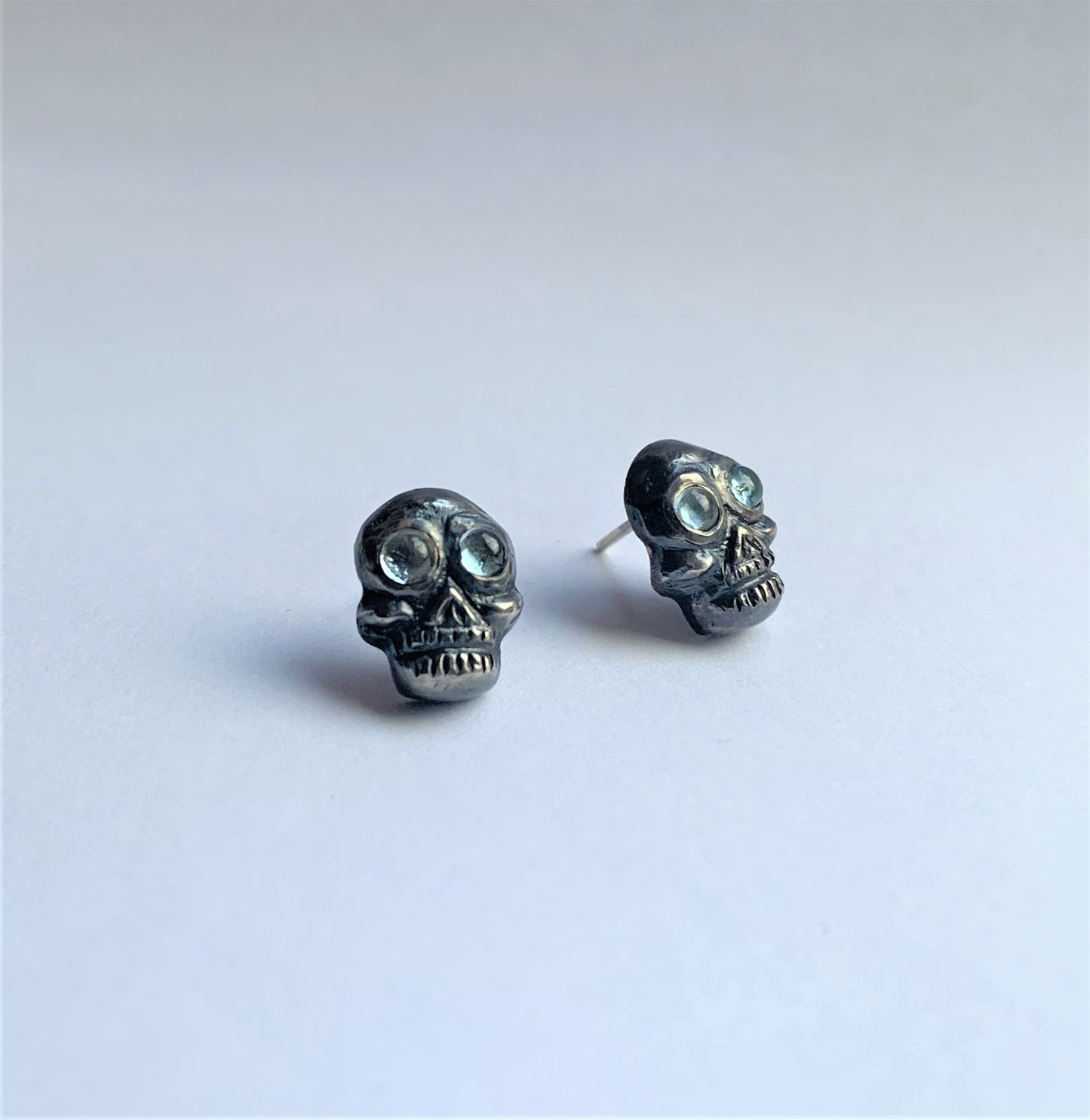 Skull Oxidized Studs set with Aquamarine