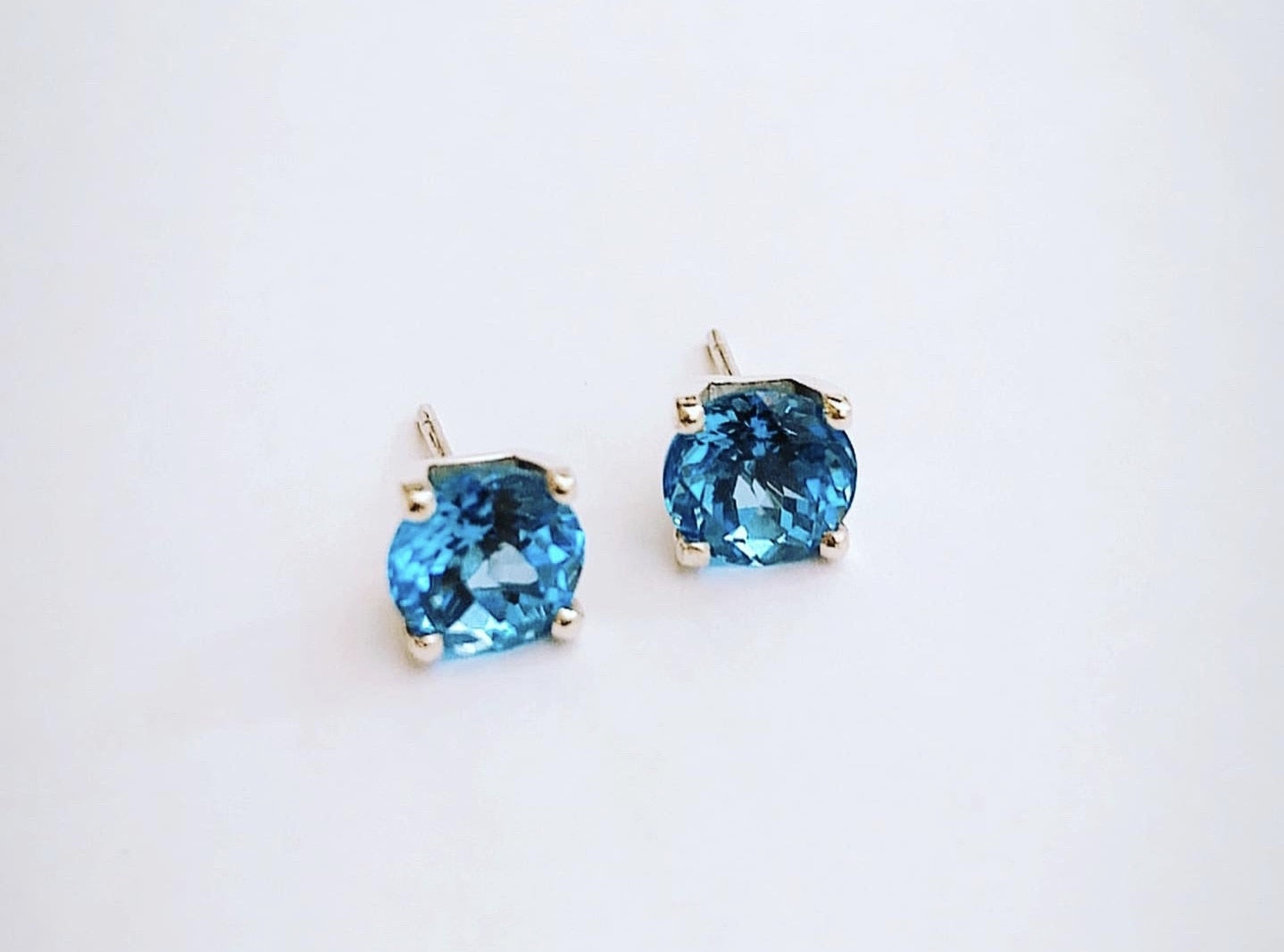 Swiss Blue Topaz stones set in square four claw earrings set in sterling silver