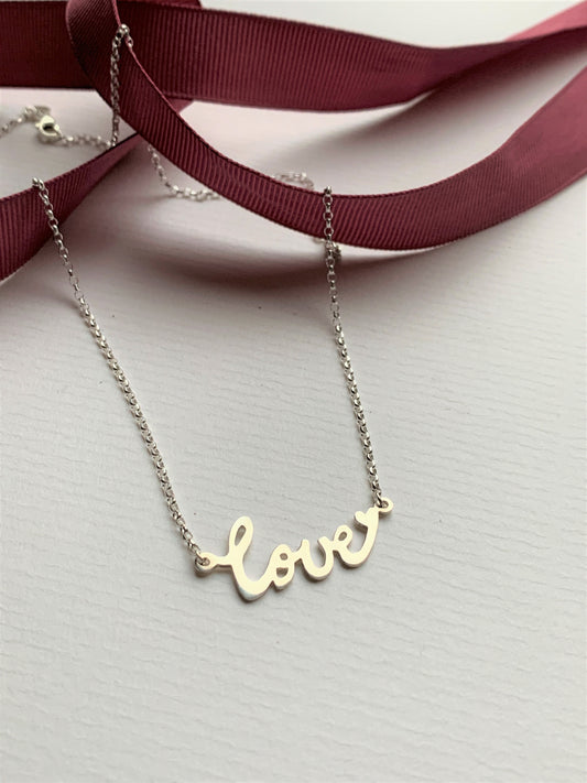 A classic necklace for every jewellery lovers wardrobe with my signature design with a hand written word and a little heart to finish the word.  Hand cut word made from recycled Sterling silver on a lovely sparkly silver belcher chain.  This lovely necklace can be worn by itself or together to create a multi chain look. Ideal present for any occasion.  Customisable options available such as gold, words and lengths. 