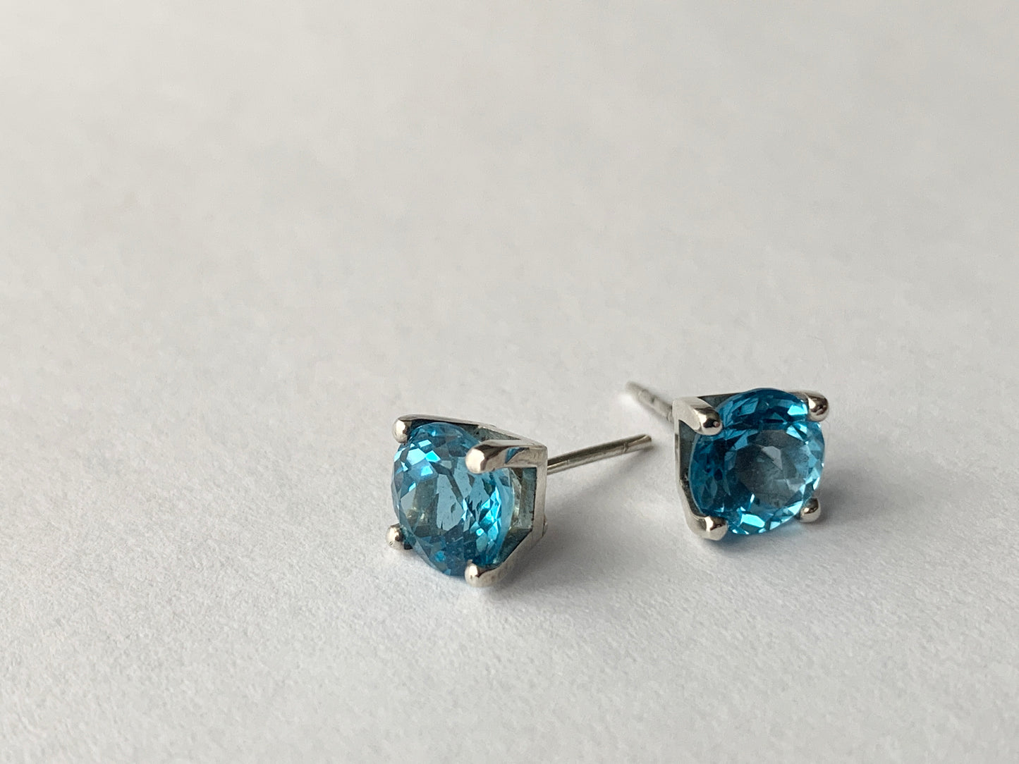 Swiss Blue Topaz stones set in square four claw earrings set in sterling silver