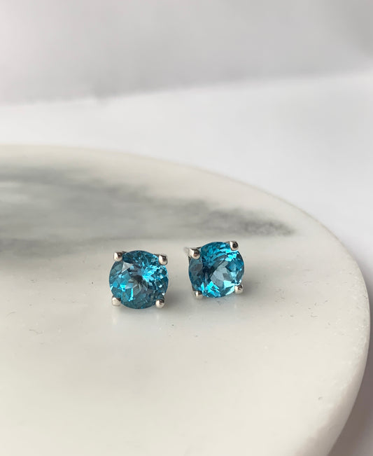 Swiss Blue Topaz stones set in square four claw earrings set in sterling silver