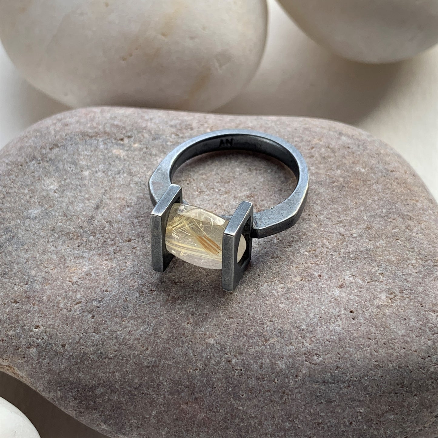 Oval golden rutilated quartz moving stone ring